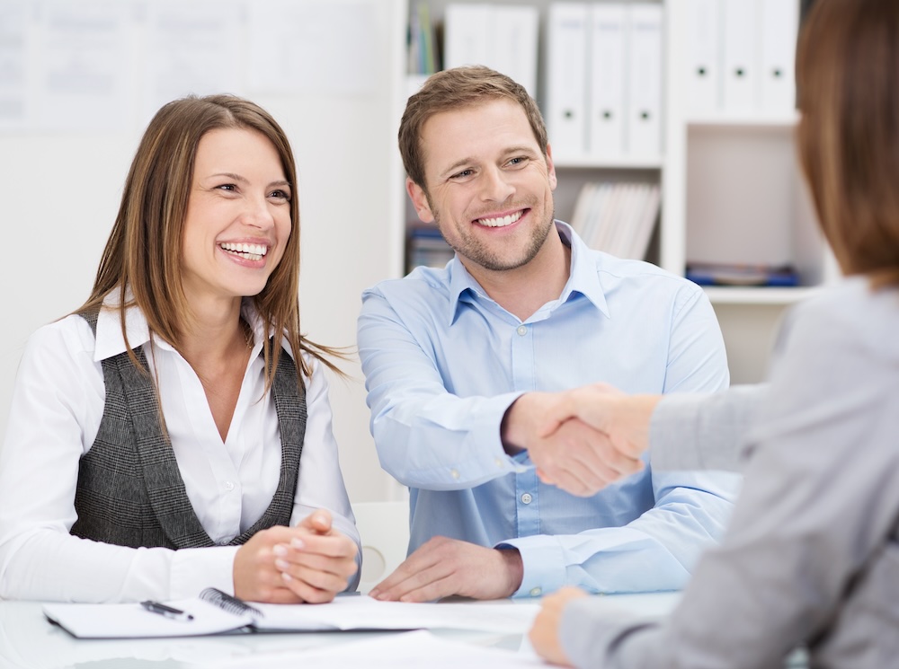 Couple meeting client to discuss seo services