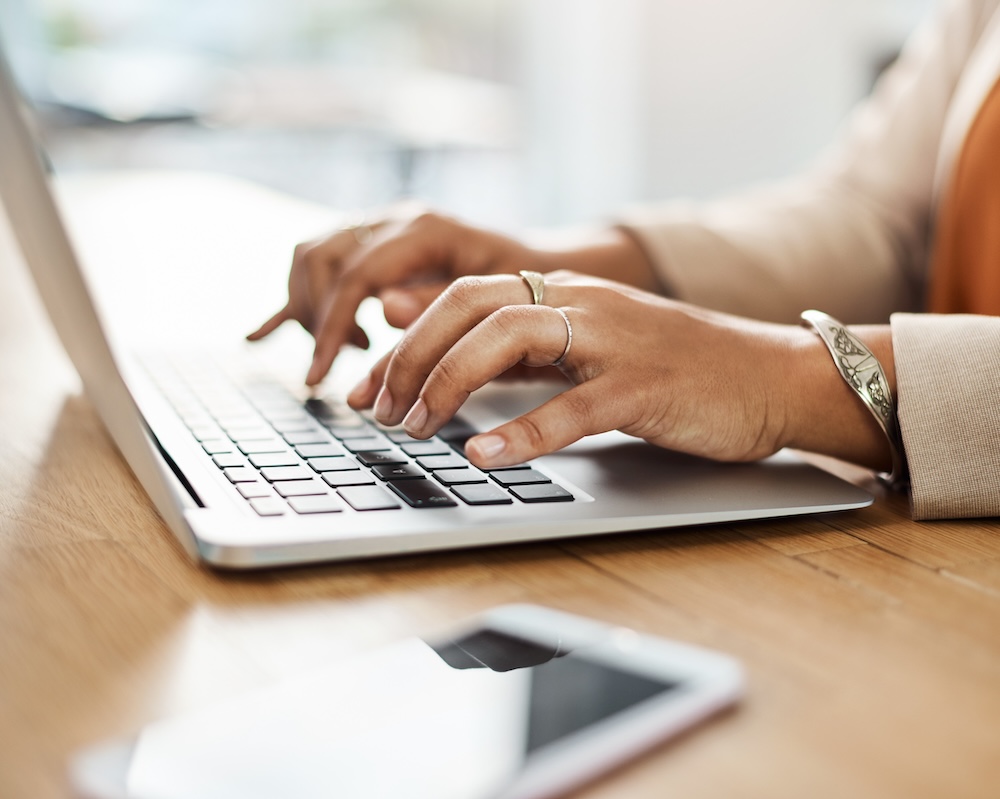 Woman typing on laptop